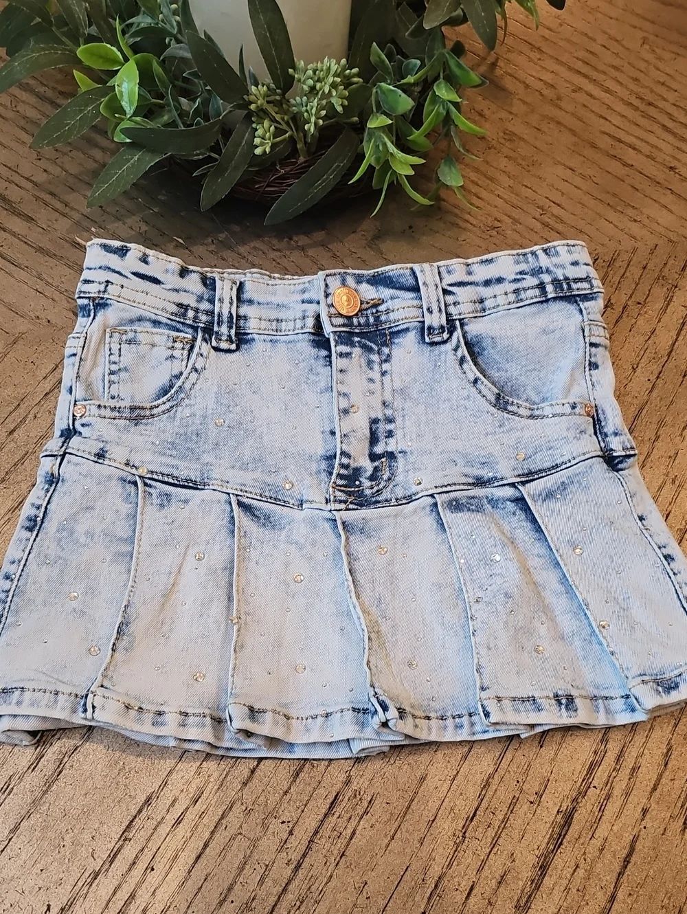 Light Wash Denim Mini Skirt with Pleated Hem and Stud Accents 6X